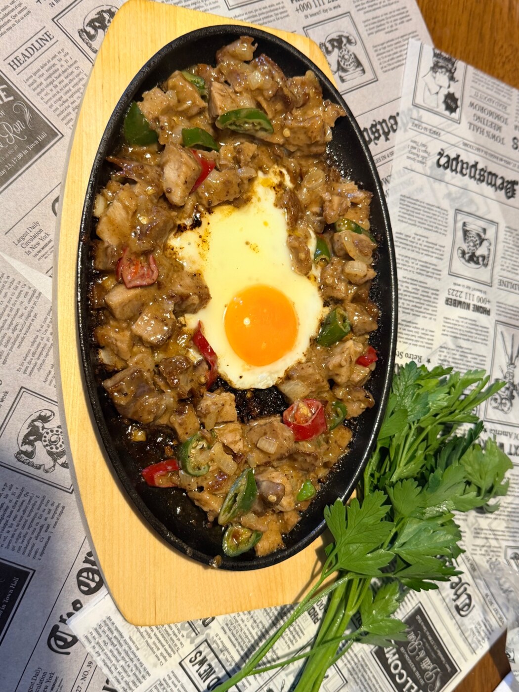 Filipino Fusion sizzling pork sisig with egg